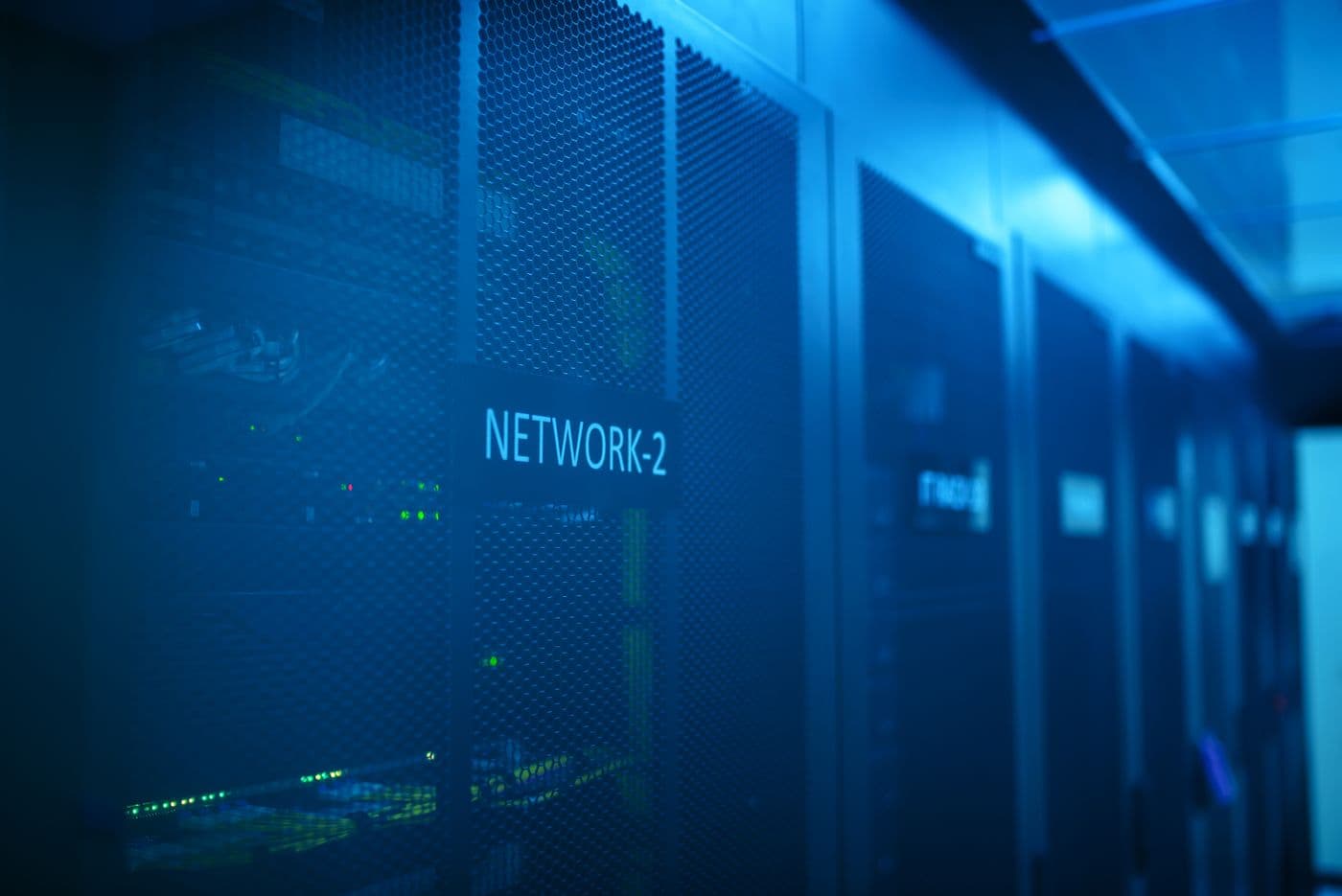 Labelled network cabinets in a data center hall of the kind Clear recruits for across the UAE and the wider Gulf