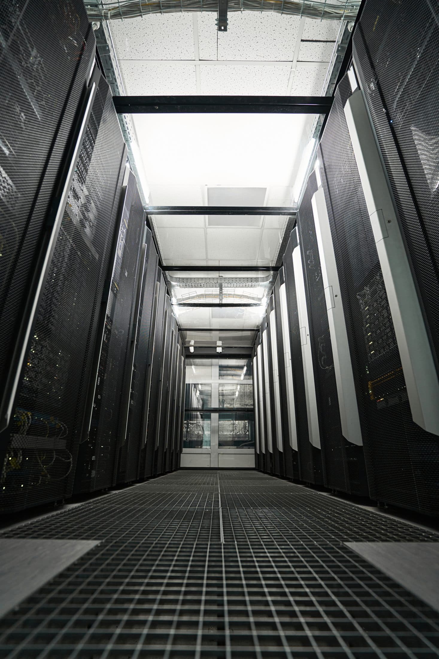 Server racks in a live UK data center hall, the mission-critical environment Clear recruits for